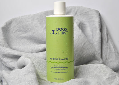 Dog shampoo bottle on grey towel - gentle sensitive skin formula made in Switzerland